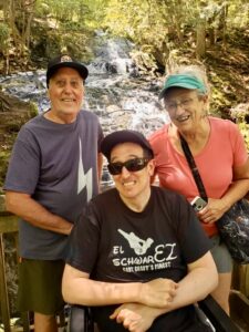 Photo of Schwartz Family in front of a waterfall: Fran, Mike and Wendy